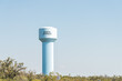 Bonita Springs water tank sign isolated against sky in Florida west coast, trees, nobody, landscape