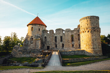 View on beautiful ruins of ancient Livonian castle in old town of Cesis, Latvia, warm sunset time.