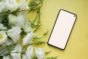 Wall Mural - phone mockup. smartphone with eustoma flowers. minimalist 