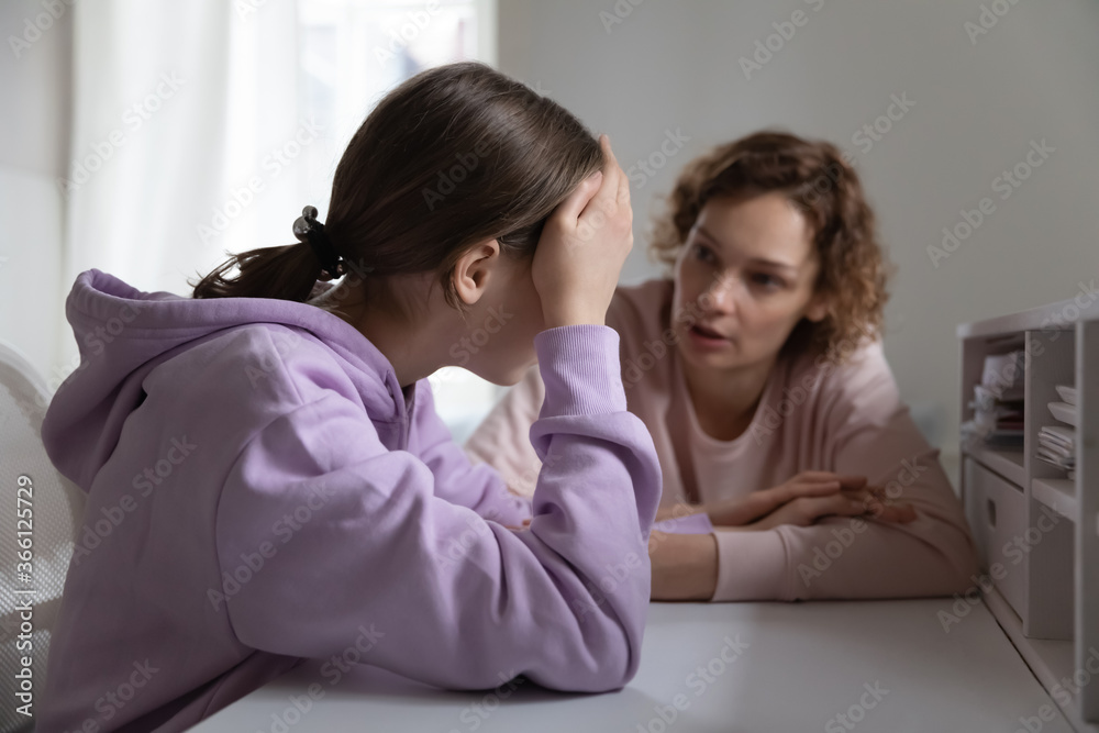 Strict mother scolding upset depressed teenage daughter for bad marks or school exam results, angry mum lecturing lazy unmotivated teen girl, generations, parent and child conflict - obrazy, fototapety, plakaty 