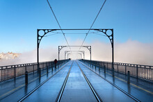 Tram Tracks In The Early Morning Mist Running Over Dom Luis I Bridge In Porto