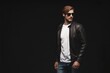 © opolja - Fashion man, Handsome serious beauty male model portrait wear sunglasses and leather jacket, young guy over black background