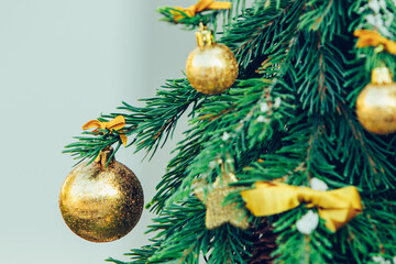 Wall Mural - Green fir tree with golden balls. Christmas wallpaper.