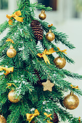 Wall Mural - Green fir tree with golden balls. Christmas wallpaper.