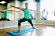 © Tetra Images - Black woman practicing yoga in studio