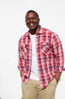 © Tetra Images - Black man standing with hands in pockets