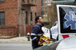 © Tetra Images - Mixed race paramedic loading patient into ambulance