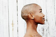 © Tetra Images - Profile of naked bald black woman
