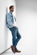 © opolja - Fashion portrait of young man wearing jeans jacket