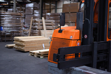 Wall Mural - Timber Flooring Factory. Pile of cut wood in factory storage warehouse. Lumber in warehouse.