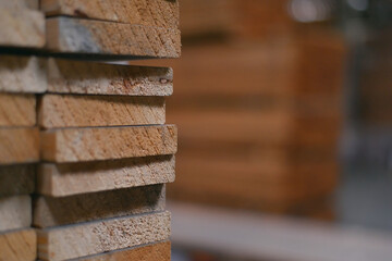 Wall Mural - Timber Flooring Factory. Pile of cut wood in factory storage warehouse. Lumber in warehouse.