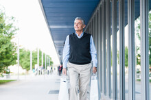 Portrait Of Senior Man With Shopping Bags