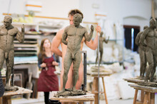 Sculptures In The Foreground, Nude Model In The Background During Class