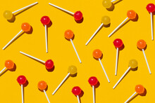 Pattern Of Lollipops Against Yellow Background