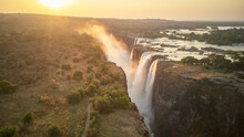 Scenic View Of Victoria Falls Against During Sunset, Zimbabwe