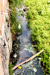 Wall Mural - itabuna, bahia / brazil - april 23, 2012: corrego where the domestic sewage system is dumped in the city of Itabuna, in the south of Bahia.