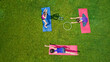 © Iuliia Sokolovska - Family fitness and sport outdoors, group of active girls doing workout in park, aerial top view from above