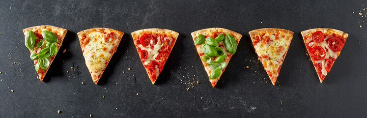 line of pizza portions with a variety of trimmings