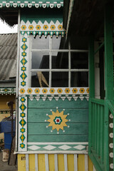 Richly decorated ornamental carved windows, frames on Lobanov's vintage wooden rural house in Leshkovo village, Sergiyev Posad district, Russia. Russian traditional national folk style in architecture