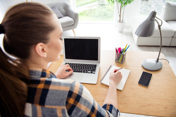 Canvas Print - Back rear cropped view photo of young teen lady school girl student laptop notebook desktop video call listen teacher lesson online noting copybook study social distance quarantine indoors