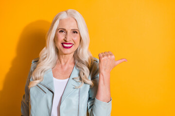 Sticker - Close-up portrait of her she nice-looking attractive charming pretty glamorous fashionable cheerful gray-haired woman showing copy space isolated on bright vivid shine vibrant yellow color background