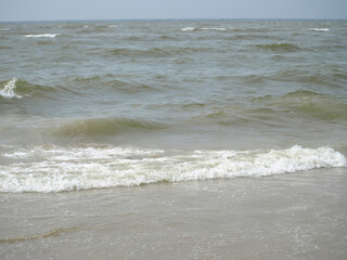 calm waves at the beach of the north sea in katwijk/nl