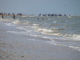 calm waves at the beach of the north sea in katwijk/nl