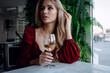 © Olena_Molchanova - woman with glass of white wine in cafe or restaurant. sexy young blonde girl