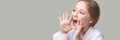 Girl shout. Little lady scream about sale. Looking side. Pretty kid with hands near head. Child portrait. Modern loud. Horizontal banner with copyspace. Positive emotion. Sound on. Yelling face