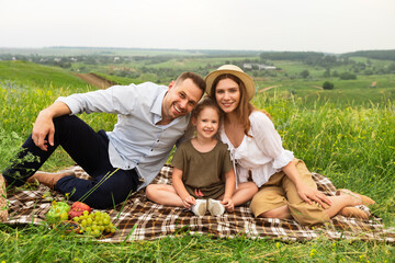 Wall Mural - Happy family spending time together on a picnic