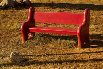 A red bench to sit in the park