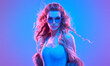 © evgenij918 - Fashion. Woman in Colorful neon light. Sexy girl in disco bodysuit, makeup. Party disco neon nightclub vibes. Fashionable model portrait, creative art neon pink blue light