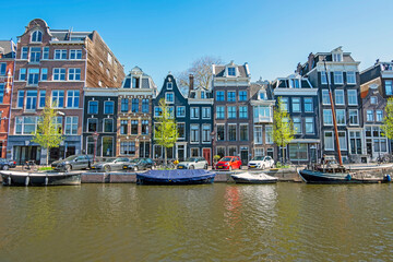 Poster - Medieval houses along the canal in Amsterdam the Netherlands