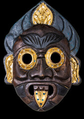 wooden mask African mask mask of the peoples of Asia, cut out the picture on a black background