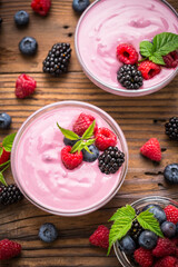 Wall Mural - Fresh berry fruit yogurt with forest fruits and mint