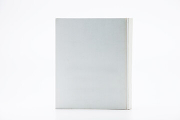 White book with no title standing on white background