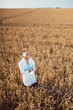 © Kzenon - Scientist doing field test of new GMO grain for better yield