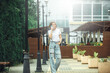 © VERSUSstudio - Young woman using mobile phone