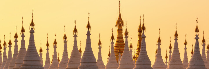 Wall Mural - White stupas of Sanda Muni Pagoda at sunset in Mandalay, Burma Myanmar