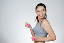 Beautiful Sport Slender Woman With Pink Dumbbell
