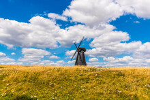 The View Across Beacon Hill Towards A Windmill On The Outskirts Of Rottingdean, Sussex, UK In Summer