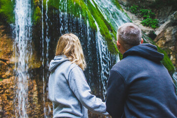 Canvas Print - People at the waterfall