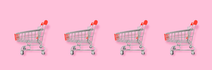 Shopping lover concept. Seamless pattern shopping cart on pink background. Flat lay composition, top view