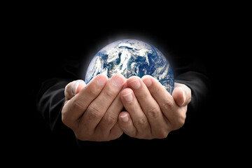 Canvas Print - environment concept. earth in hands on black background. elements of this image furnished by nasa