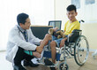 © Nuad Contributor - People with disabilities are consulting a doctor.