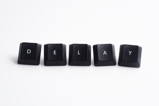 Delay word on black cube with white background