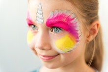Little Caucasian Cute Girl With Unicorn Face Painting