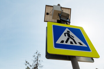 The pedestrian crossing sign powered by solar panels installed above. Traffic signs and rules.