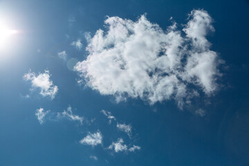 Wall Mural - blue sky with white clouds and sun. beautiful natural background.