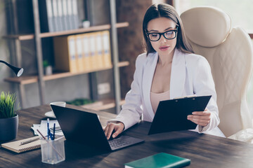 Sticker - Photo of attractive business lady hold clipboard read contract typing notebook table information staff colleagues partners home office social distance formal wear specs suit indoors